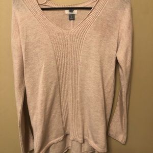 Light pink v-neck sweater.